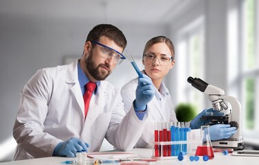 Poster - Young scientist work with microscope for test at laboratory.