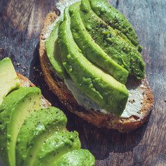 Wall Mural - Avocado on toast, rye bread sandwich close up