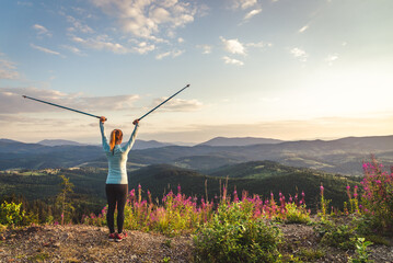 Young woman n the top of the mountains