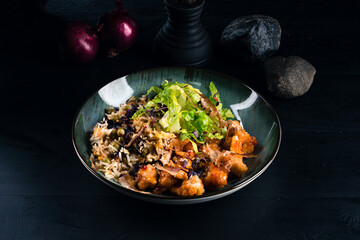 Canvas Print - Fried pieces of chicken fillet with rice and greens.