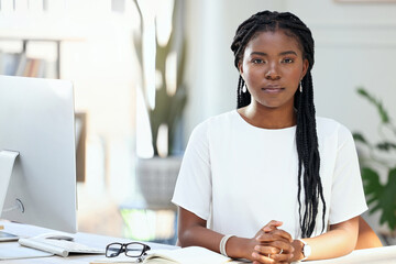 Poster - Everything I have, Ive worked for. Shot of a young businesswoman sitting at her desk.