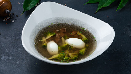 Canvas Print - Diet soup with boiled pieces of beef, egg and broccoli in a bowl.