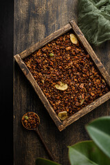 Wall Mural - granola on a dark wooden background