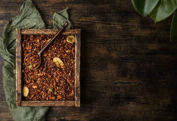 Wall Mural - granola on a dark wooden background