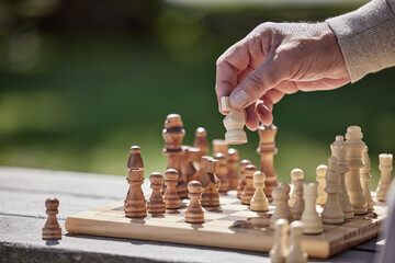 Wall Mural - Make moves that matter. Shot of an unrecognisable senior man playing a game of chess outside.