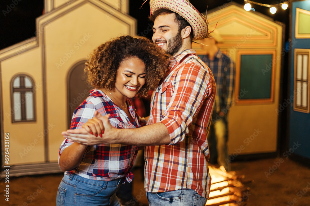 Brazilian couple wearing traditional clothes for Festa Junina - June