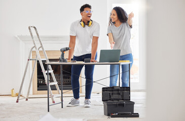 Poster - Renovating a house is a no brainer for people who like a challenge. Shot of a young couple using a laptop while busy renovating a house.
