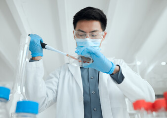 Poster - Slow and steady wins the race. Shot of a young male scientist inserting a sample into a petri dish.