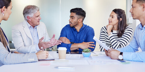 Poster - Lets get on the same page. Shot of a group of businesspeople having a meeting at work.