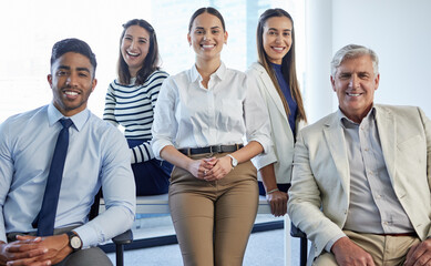 Sticker - Their services come highly recommended. Shot of a group of businesspeople posing together in an office.