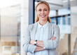 © Michael C/peopleimages.com - Strong women set the standard for success. Portrait of a confident mature businesswoman working in a modern office.