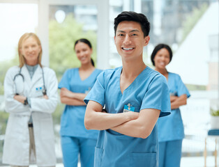 Poster - Here to save a life. Shot of a group of medical practitioners standing together in a hospital.