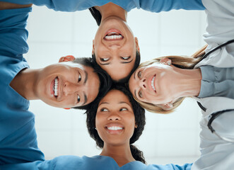 Poster - There are times for playing. Cropped shot of a group of medical practitioners having a private huddle at work.