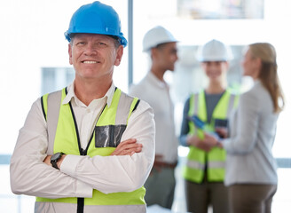 Aufkleber - Ibe built a great team over the years. Cropped portrait of a handsome mature male construction worker standing with his arms folded and his colleagues in the background.