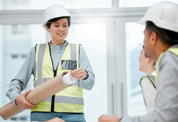 Poster - I have the plans right here.... Cropped shot of an attractive young female construction worker unpacking blueprints during a meeting.