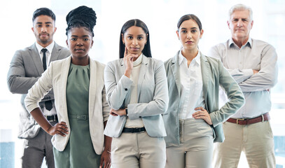 Poster - The only team you need. Cropped portrait of a diverse group of corporate businesspeople standing in their office.