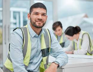 Poster - Well get the job done. Cropped portrait of a handsome young male construction worker sitting in a meeting with his colleagues.