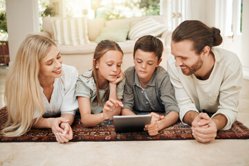 Sticker - What have you got to show us today. Shot of a young family spending time together at home while using a digital tablet.