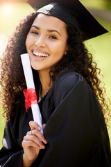 Wall Mural - Im so happy that this is finally all mine. Portrait of a young woman holding her diploma on graduation day.