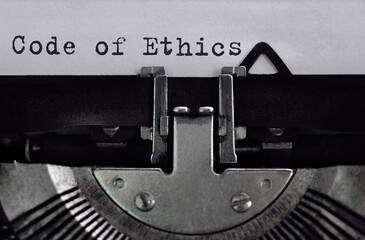 Poster - text code of ethics typed on retro typewriter