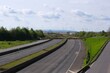 Ende einer Autobahn mit Blick auf einen Braunkohle Tagebau
