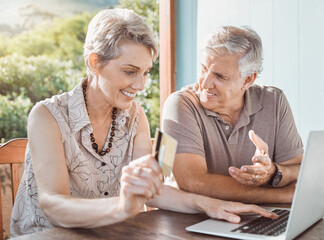 Poster - So this is the online sale youve been waiting for. Shot of a mature couple sitting together while using a laptop and a credit card.