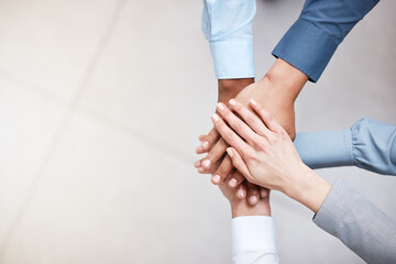 Poster - No holding back. Shot of a group of business people with their hands stacked.