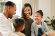 © K Abrahams/peopleimages.com - They love just chilling with mom and dad. Shot of a young family bonding together at home.