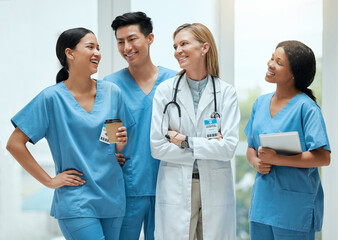 Wall Mural - Start the day with a chuckle. Shot of a group of medical practitioners having a discussion in a hospital.