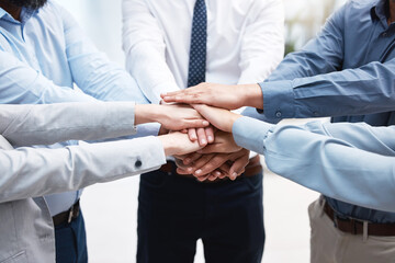Poster - no funny business. shot of a group of business people with their hands stacked.