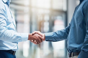 Poster - Great partnerships start with a firm handshake. Shot of two unrecognizable businesspeople shaking hands in an office at work.