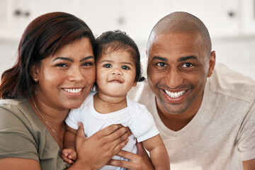 Sticker - A blessing in human form. Shot of a young family spending time together at home.