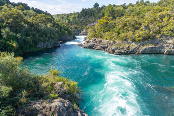 Sticker - Swirling and surging river water through rocky ravine