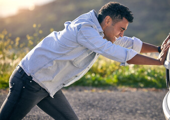 Poster - Can I push start her. Cropped shot of a handdsome young man pushing his car after suffering a vehicle breakdown.