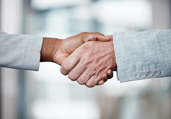 Poster - Weve made a deal. Shot of two unrecognizable businespeople shaking hands in an office at work.