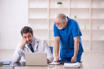 Two male doctors in telemedicine concept