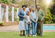 © S Fanti/peopleimages.com - Picture perfect family. Full length portrait of a multi-generational family standing outside in the garden.