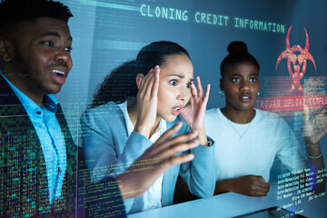 Poster - Theyre stealing the data. Shot of a diverse group of businesspeople sitting together and feeling stressed during a systems hack.