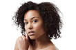 © Khushboo/peopleimages.com - Skincare, curly hair and portrait of a woman with natural haircare and wellness from skin glow. Dermatology, young face and African female with youth beauty isolated on a transparent png background