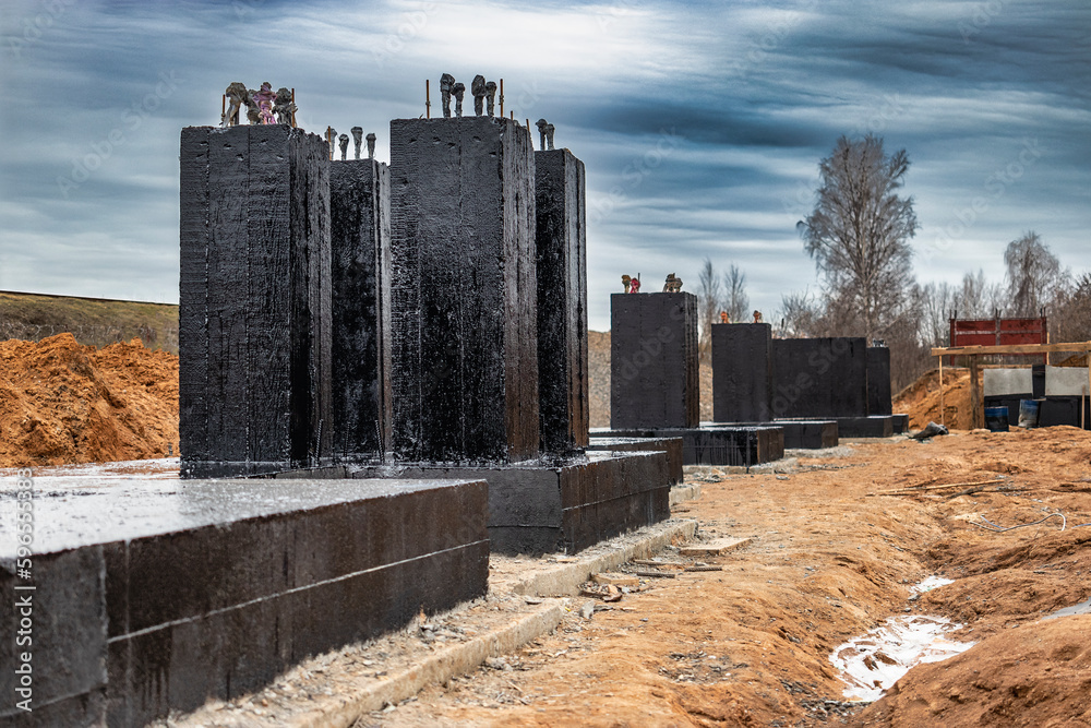 Monolithic reinforced concrete foundation waterproofed with bituminous ...