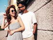 © halayalex - Smiling beautiful woman and her handsome boyfriend. Woman in casual summer clothes. Happy cheerful family. Female having fun. Sexy couple posing in the street at sunny day. In hat and sunglasses