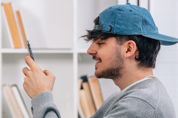 Sticker - student looking at mobile phone or smartphone