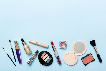 Wall Mural - Professional makeup tools. Top view. Flat lay. Beauty, decorative cosmetics. Makeup brushes set and color eyeshadow palette on table background. Minimalistic style