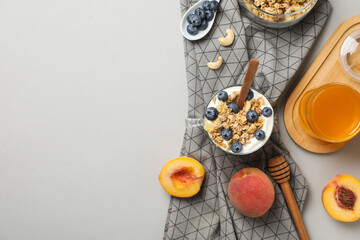 Wall Mural - Tasty and nutritious breakfast concept - muesli with yogurt