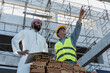 © Jack Tamrong - Construction Engineer man showing building project to Arab businessman developer in construction site
