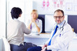 © lenets_tan - Portrait of senior doctor in office sitting at the desk.