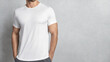 © oxinoxi - Athletic man with white t-shirt grey background mockup