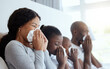 © S Fanti/peopleimages.com - Throught sickness and health. Shot of a family blowing their noses while sick at home.