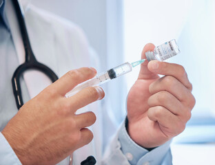 Poster - Keeping his patients safe. Shot of a dentist filling a needle with covid vaccine.