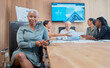 © Oostendorp/peopleimages.com - Confident, powerful african american businesswoman in a meeting with her colleagues holding a wireless tablet. Young business professional in her office with her colleagues in collaborating